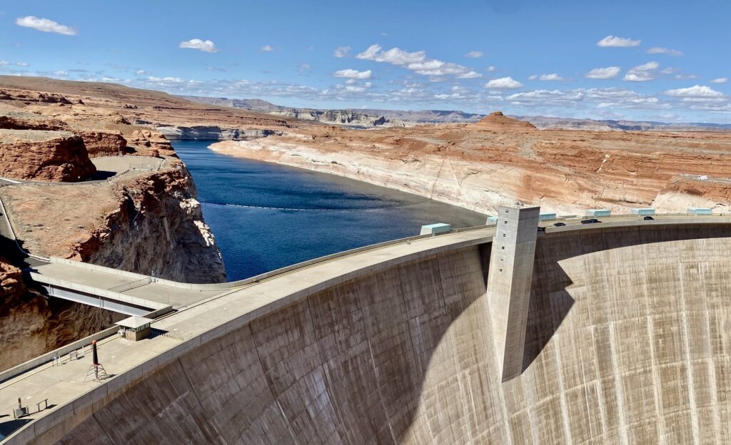 Glen Canyon Dam holds back the Colorado River creating Lake Powell in Page, Arizona. The white washed sandstone visible on the right of the canyon wall often called the lake's "bathtub ring" reflects the dropping water level in the reservoir. (Photo by Dennis Mckenna)