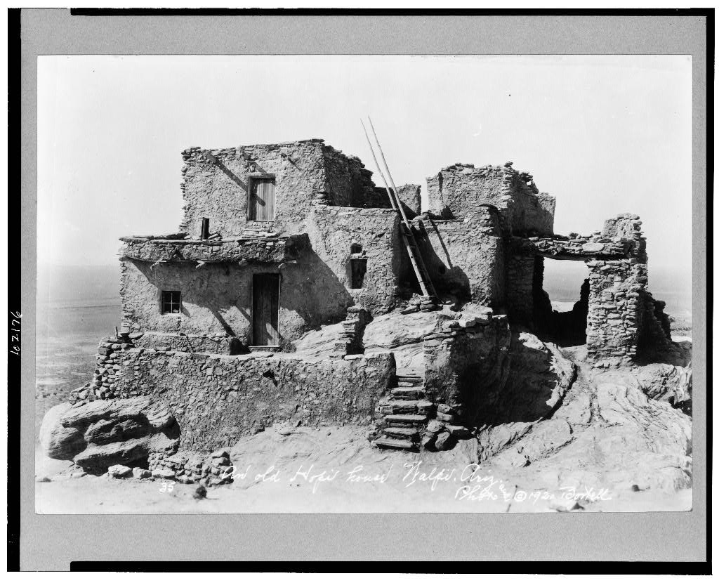 A photo of an old Hopi house in the village of Walpi on the First Mesa, Hopi Reservation. (Photo by Bostell c1920, LOC)