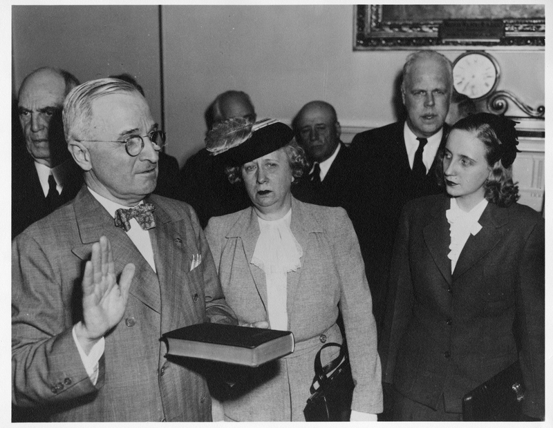 Harry S. Truman is sworn in as President of the United States on April 12, 1945. His wife Bess and daughter Margaret stand at his right. (Truman Library)