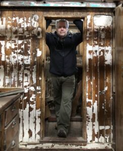 The author, Russ Eagle below deck of The Western Flyer in 2018 before restoration was complete.