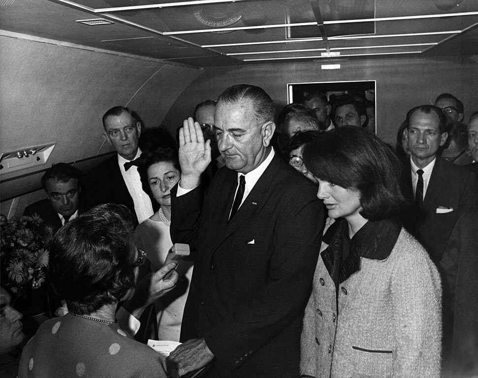 Lyndon B. Johnson takes the oath of office aboard Air Force One, 22 November 1963. (White House photo)