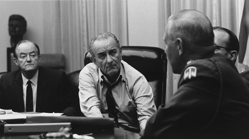 President Johnson listens to Gen. Creighton Abrams, then U.S. military commander in Vietnam, during a National Security Council meeting in March 1968, four days before announcing his decision to not run for reelection. (LBJ Library)