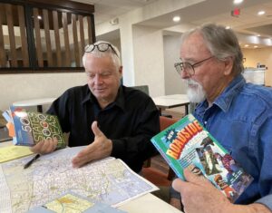 Clay and Listening to America's chief scout plan out the LTA Travels With Charley expedition.