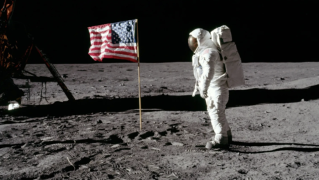 Astronaut Buzz Aldrin stands on the moon facing a US flag during the Apollo 11 mission in July 1969. (NASA)