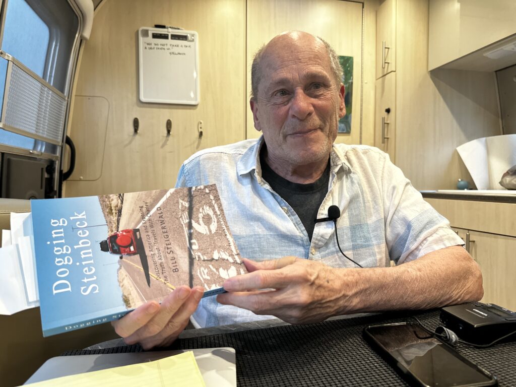 Bill Steigerwald, holding a copy of his book, Dogging Steinbeck.