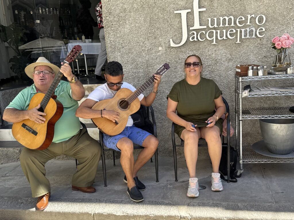 The glorious music of a trio playing on Havana side street transports Clay and his guests.