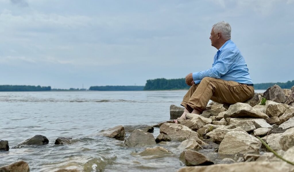 Clay Jenkinson at the confluence of the Mississippi and Missouri Rivers. (Photo by Nolan Johnson)