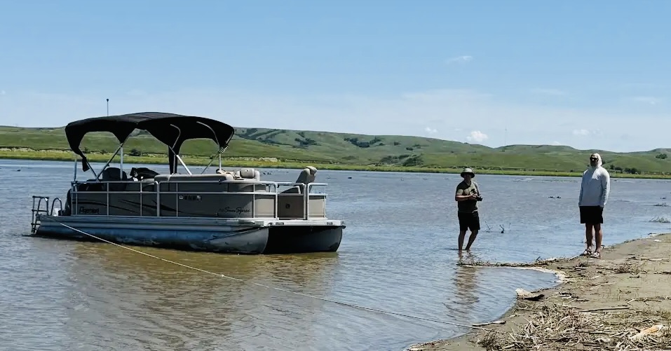 The two rapscallions, Nolan Johnson (left) and Brian Jackson and the pontoon boat.