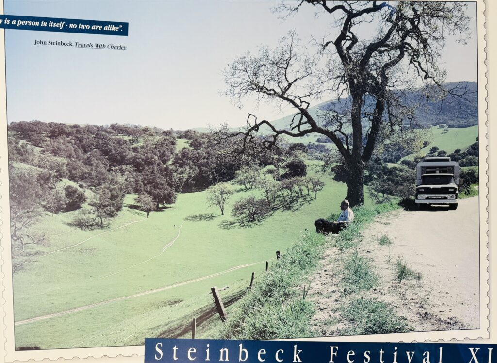 A rare photograph of John Steinbeck, his dog Charley, and the truck camper, Rocinante, taken in the hills near Salinas, California. The image is one of the few that exist from Steinbeck's 1960 road trip that became the basis for Travels with Charley.