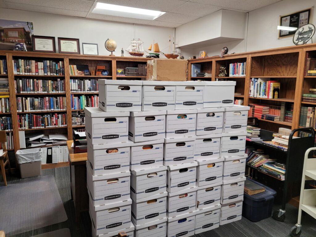 About 40 boxes of books culled from Clay’s massive personal library sit ready to be taken to their new home.