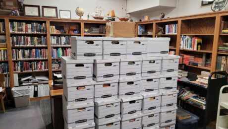 About 40 boxes of books culled from Clay’s massive personal library sit ready to be taken to their new home.