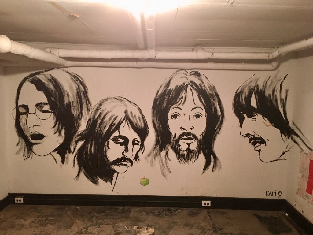A friend, Kari Armstrong, painted this mural of the Beatles on the basement wall of Clay’s home when he was 16.