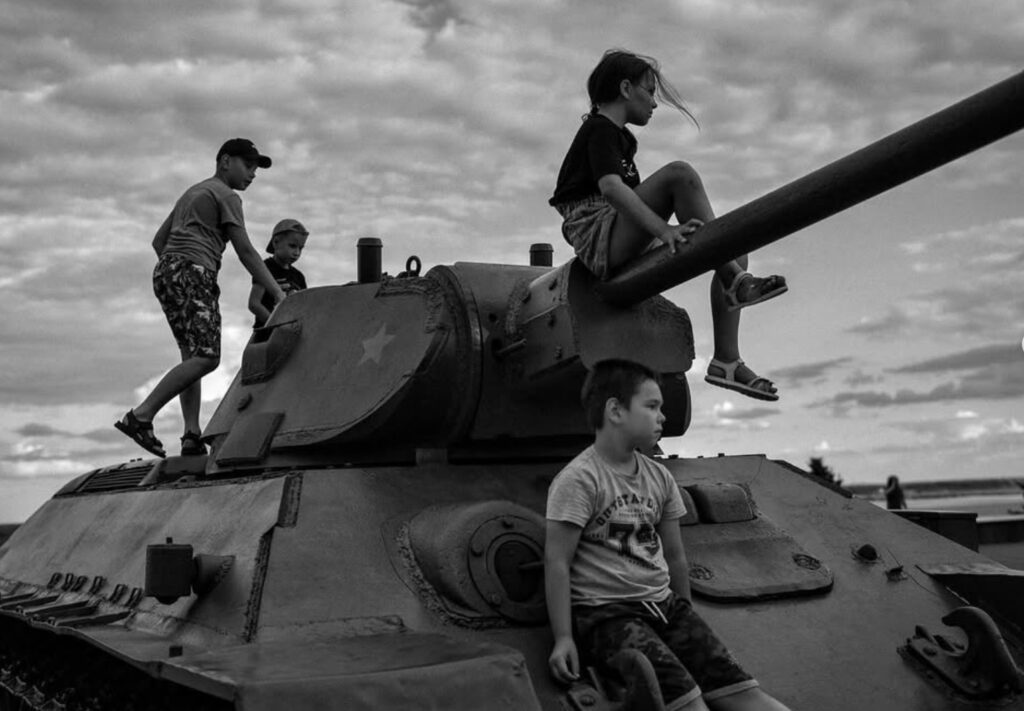 Children playing on a Red Army tank from War World II. Volgograd, Russia. July 2023