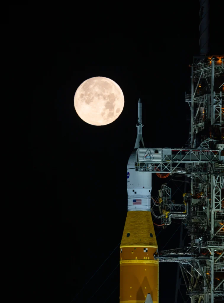 A full moon is seen shining over NASA’s SLS (Space Launch System) and Orion spacecraft. (NASA)