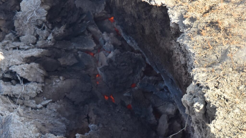 Burning coal vein in Theodore Roosevelt National Park. These natural fires can be started by lightning, prairie fires, or even spontaneous combustion.